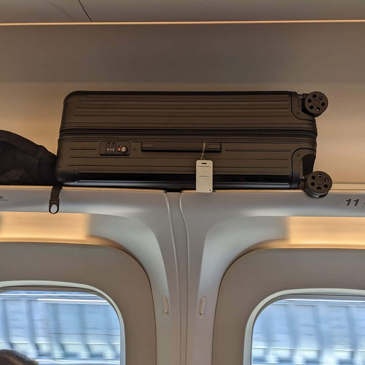 luggage stored overhead on shinkansen